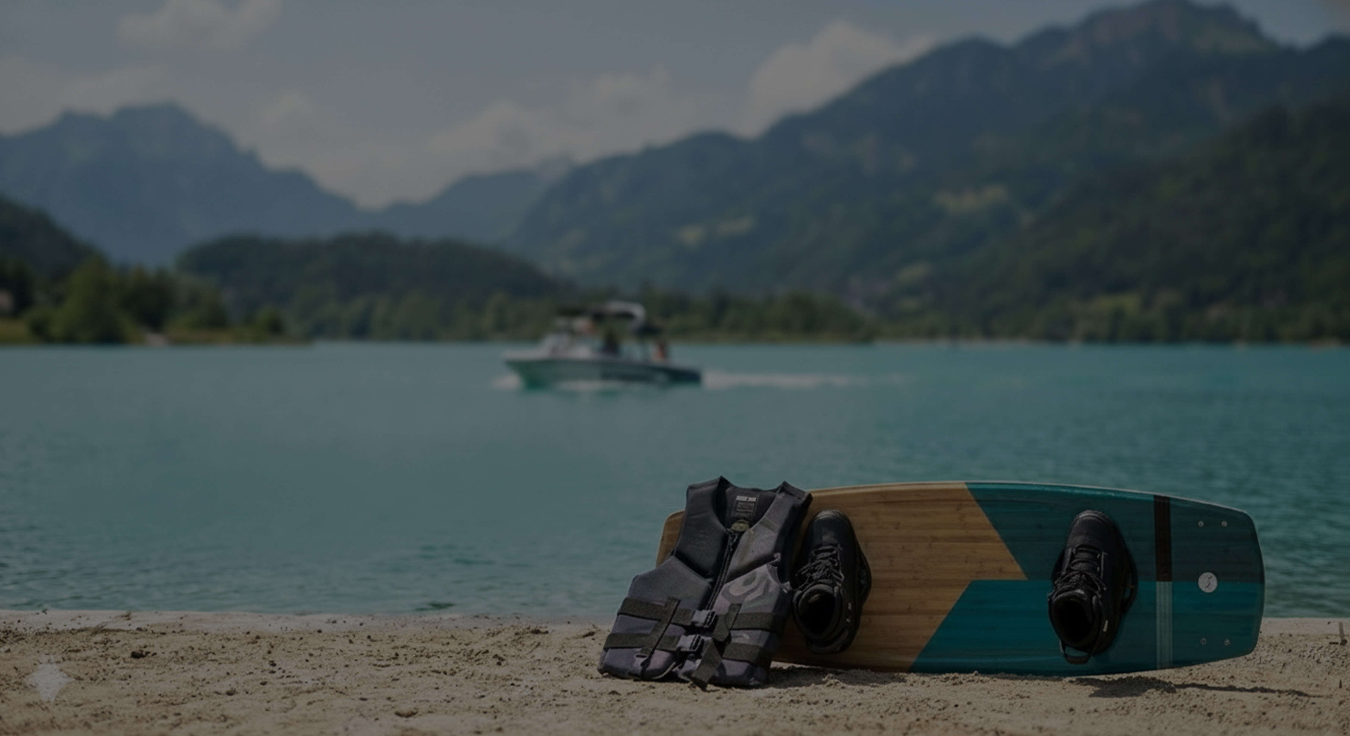 Wakeboarder carving through the wake